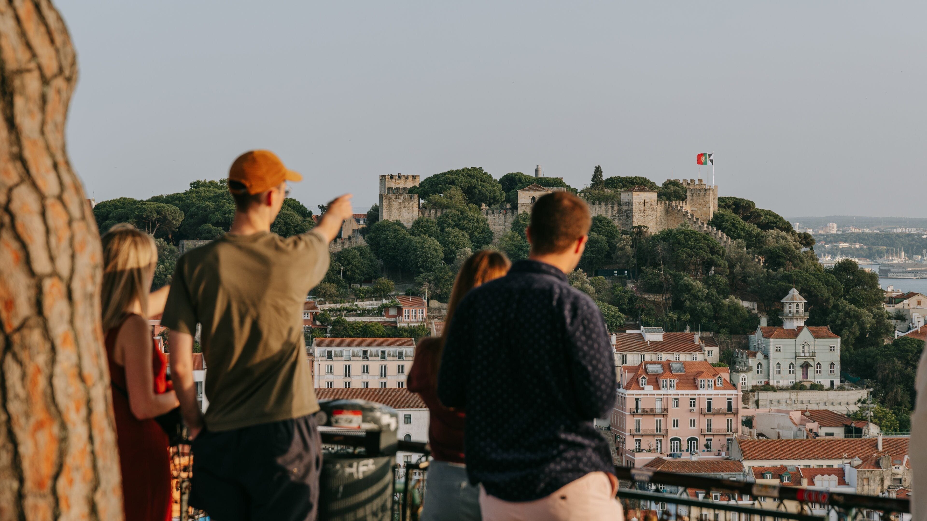 Lisbon Old Town which includes views as well as a small group of people