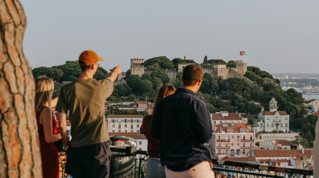 Lisbon Old Town which includes views as well as a small group of people
