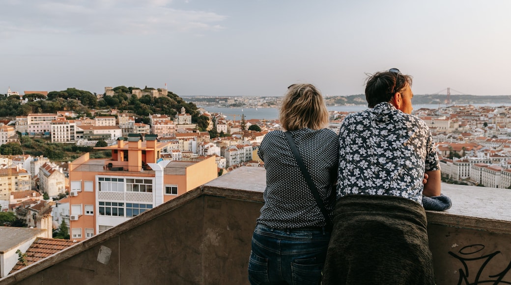 Lisbon Old Town showing a city and views as well as a couple