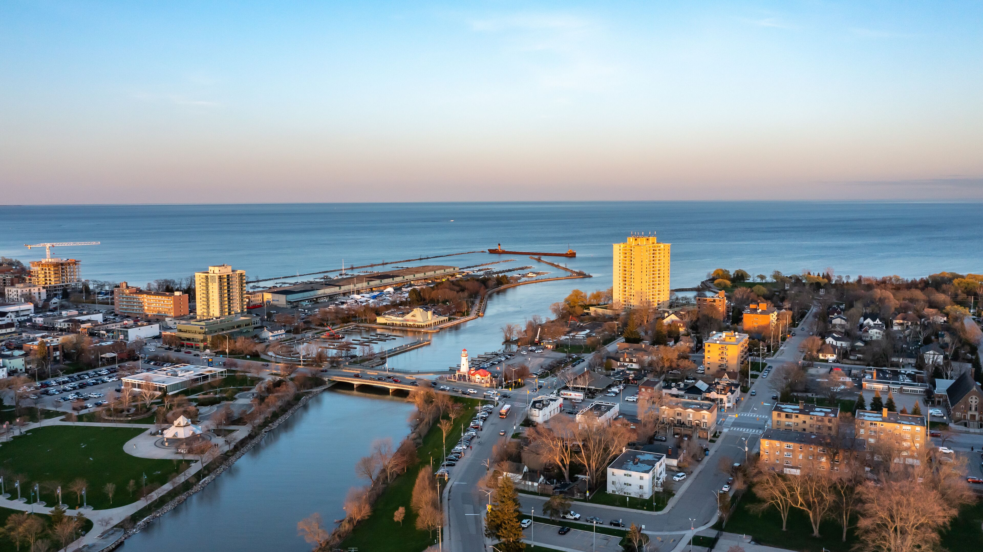Aerial view of Port Credit at the mouth of the Credit River at sunset facing Lake Ontario in the summer.