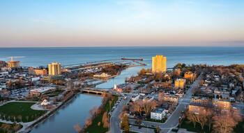 Aerial view of Port Credit at the mouth of the Credit River at sunset facing Lake Ontario in the summer.