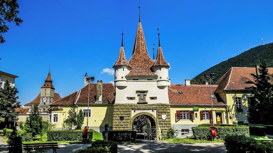 Catherine's Gate in Brasov, Romania. It was built by the Tailors’ Guild in 1559 for defensive purposes instead of an old gate destroyed by the flood in 1526. It is named after St. Catherine's Monastery that was situated there in former times. It is the only original city gate to have survived from medieval times. In fact the central tower is only a part of the original gate. Documents talk about the existence of a wooden structure which was demolished in 1827. The original structure can be seen at the Weaver's Bastion where the large model of Brasov in 1600 is displayed.