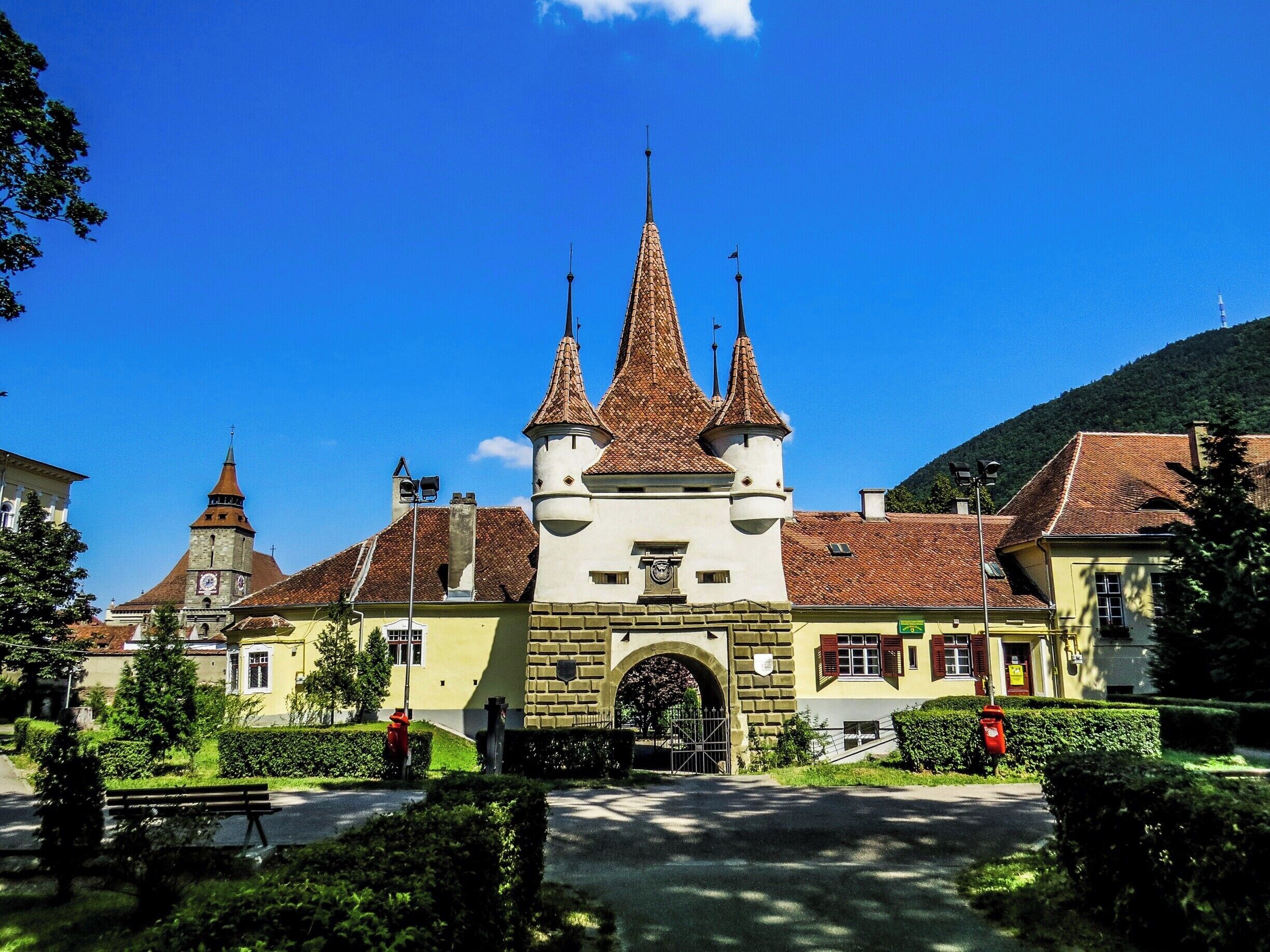 A castle with multiple spires and a large arched entrance.