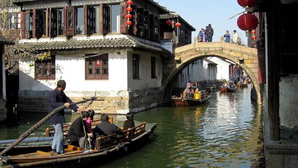 About 1.5 hours west of Shanghai, Suzhou is known as the "Venice of China" with its canals and stone bridges. Like in Venice, you can take a riverboat ride on the canals.
Our boat was steered by an extremely strong little old man who serenaded us by singing Chinese opera.
Built in 514 BC, Suzhou is an ancient city with a 2500 years' history. The unique characteristics of the past are still retained in present-day Suzhou. The double-chessboard layout of Suzhou, with 'the streets and rivers go side by side while the water and land routes run in parallel', are preserved basically intact. Strolling the streets, you can feel the unique lingering charm of this landscape left by its long history.
#weekendgetaway