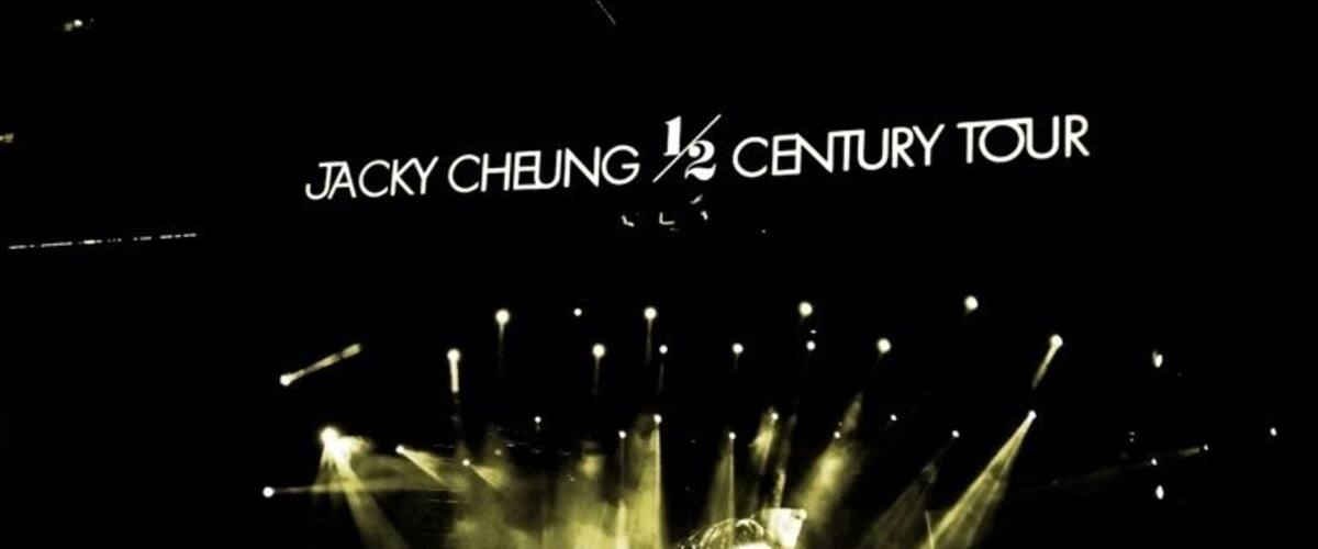 A concert stage with lights and the text "JACKY CHEUNG 1/2 CENTURY TOUR".