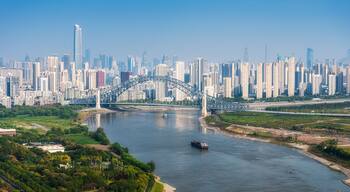 Aerial daytime view of Hankou CBD alongside Han River waterfront, Wuhan, Hubei, China