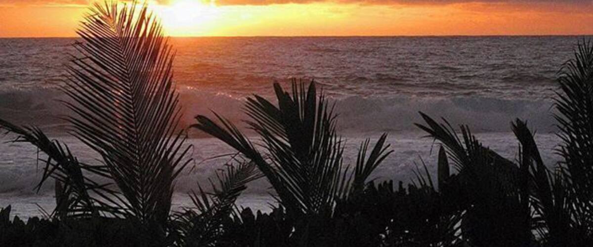 Sunrise on the South Pacific island of Rarotonga.  The island way of life here is something special.  The people have such a joy in life that it's bound to rub off.  
For more, see 'Paradise Found:Why Rarotonga Will Make you  Happy' at: http://www.travelblissnow.com/paradise-found-why-rarotonga-will-make-you-happy/