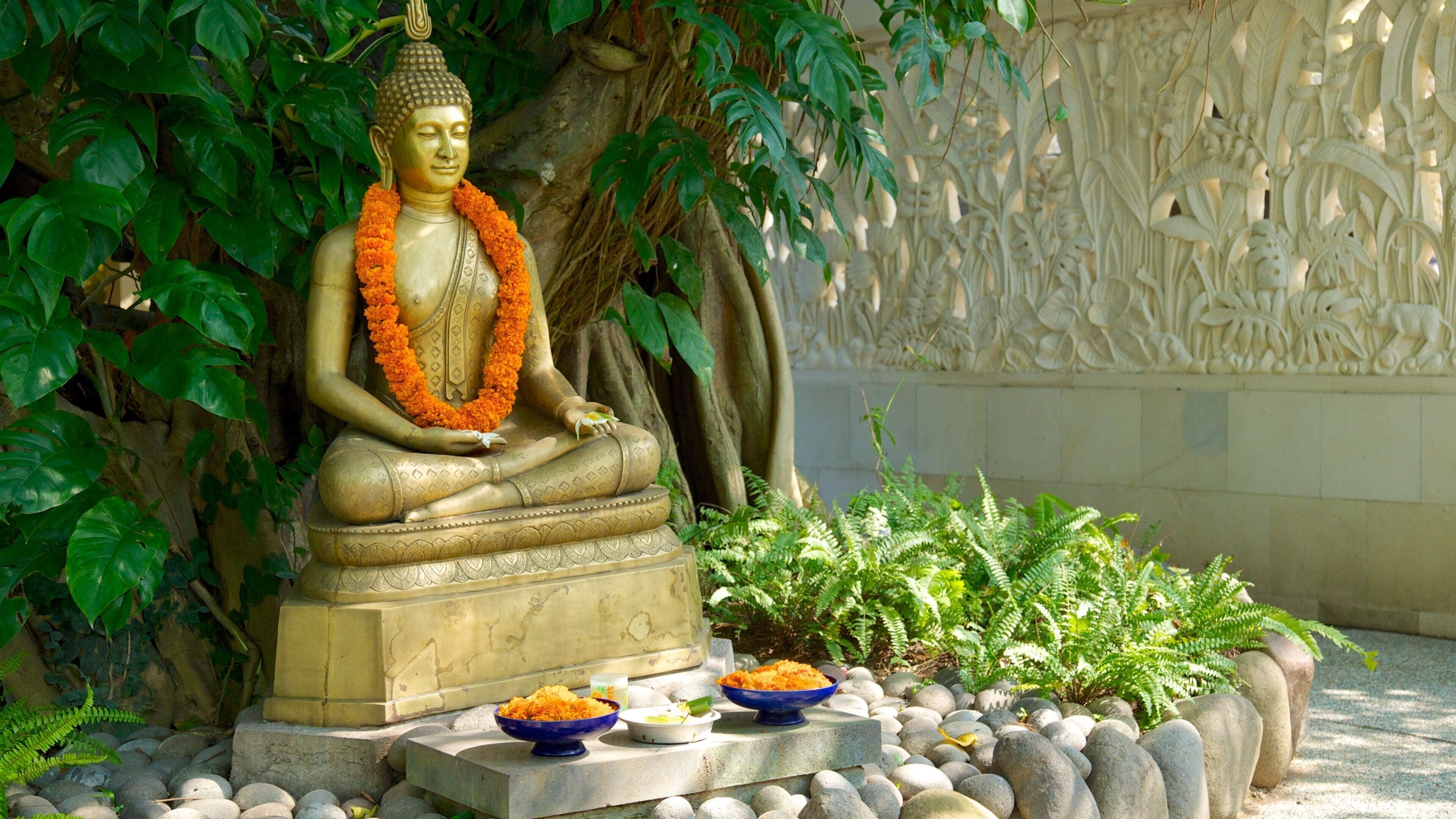 Kartika Plaza featuring a statue or sculpture and religious aspects