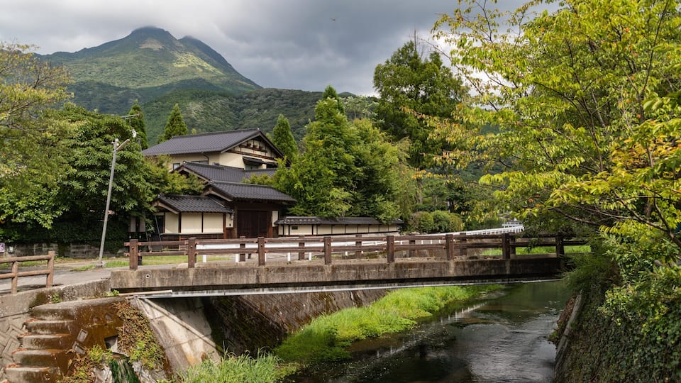 Yufuin Onsen showing a river or creek, a small town or village and a bridge