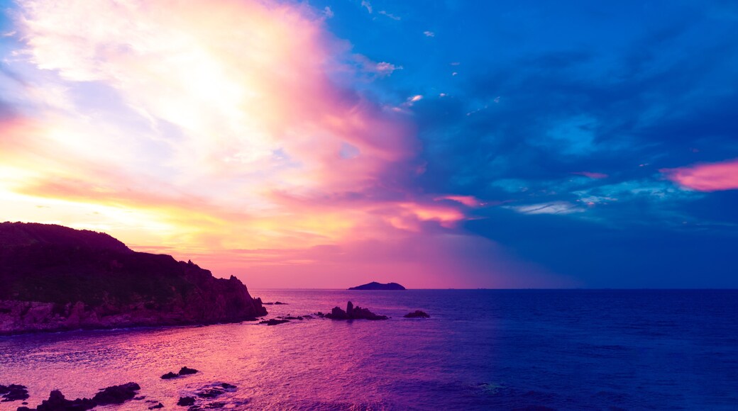 Chenghai Mountain, Weihai, Shandong, China, overlooking Donkey island Island Sunset Pink Sky.