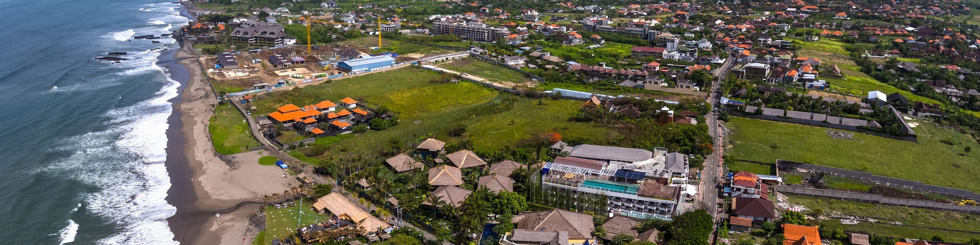 Aerial panorama of the western balinese coast near the village of Canggu. Echo beach visible on the left. Indonesia