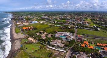 Aerial panorama of the western balinese coast near the village of Canggu. Echo beach visible on the left. Indonesia