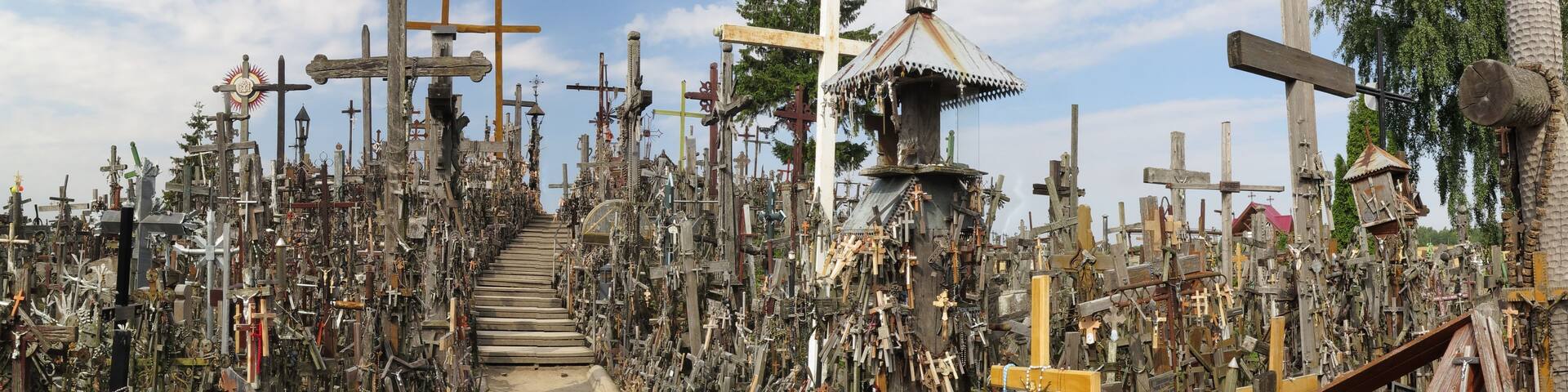 A cemetery filled with numerous crosses and memorials.