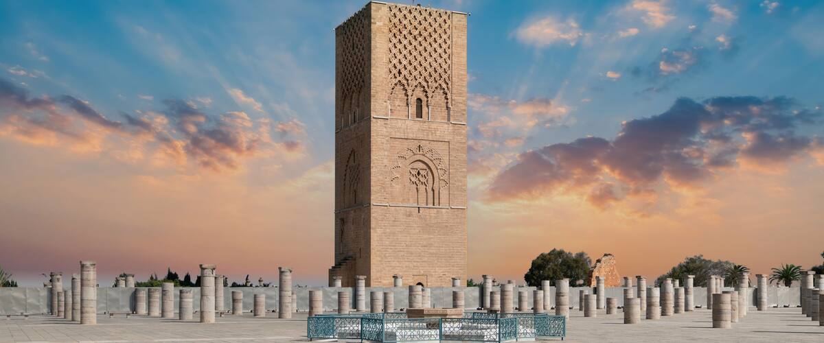 Rabat, Morocco - September 2022: Hassan tower at Mausoleum of Mohammed V, built to honor the memory of the late King Mohammed V during sunset.