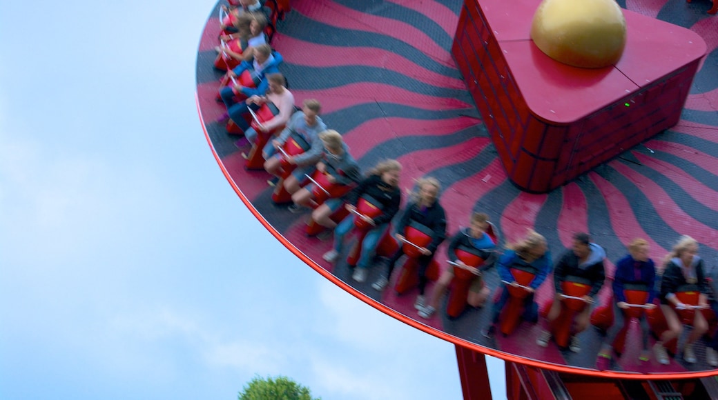 Centrum showing rides as well as a small group of people