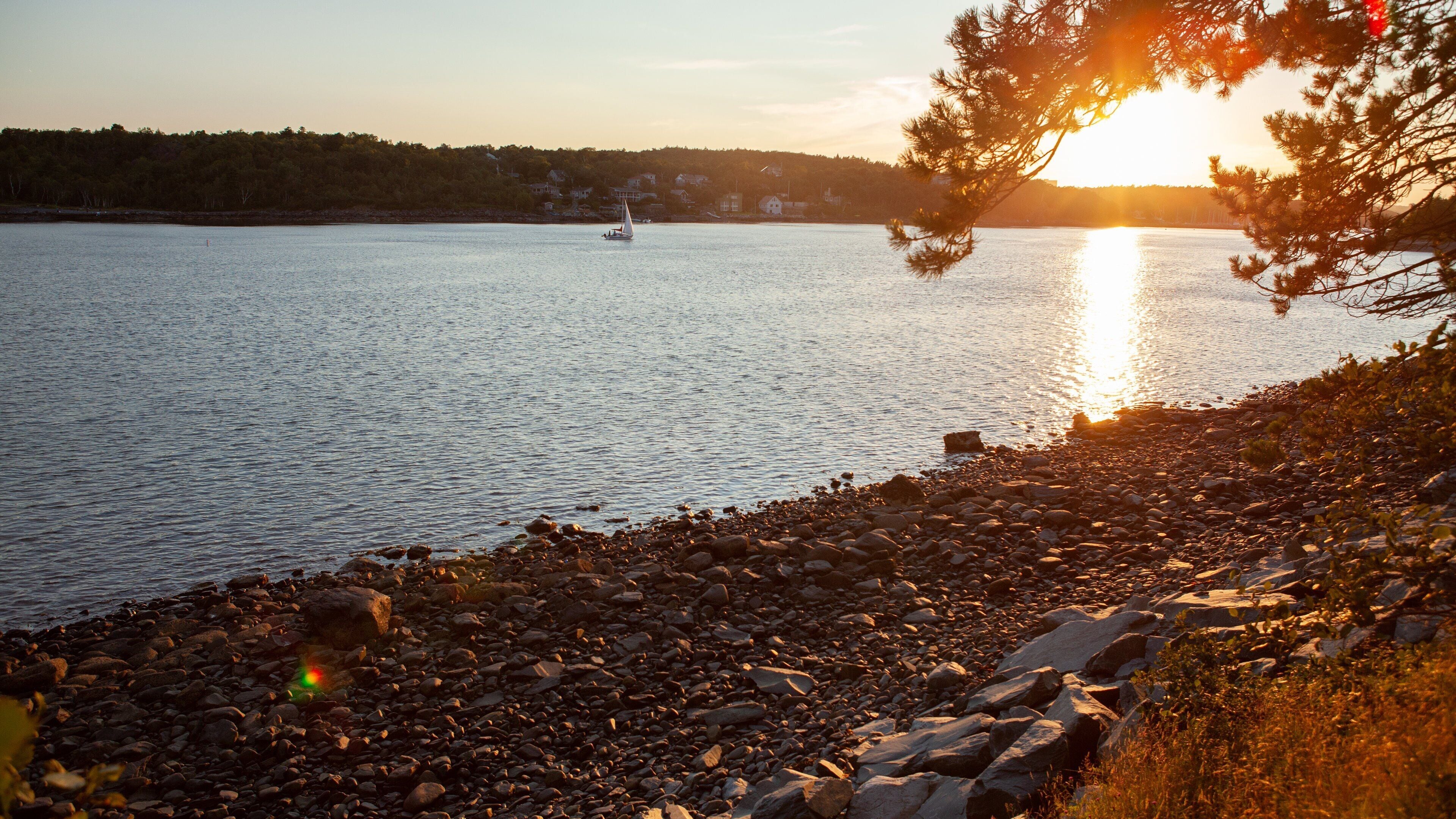 Point Pleasant Park which includes a sunset, landscape views and a pebble beach