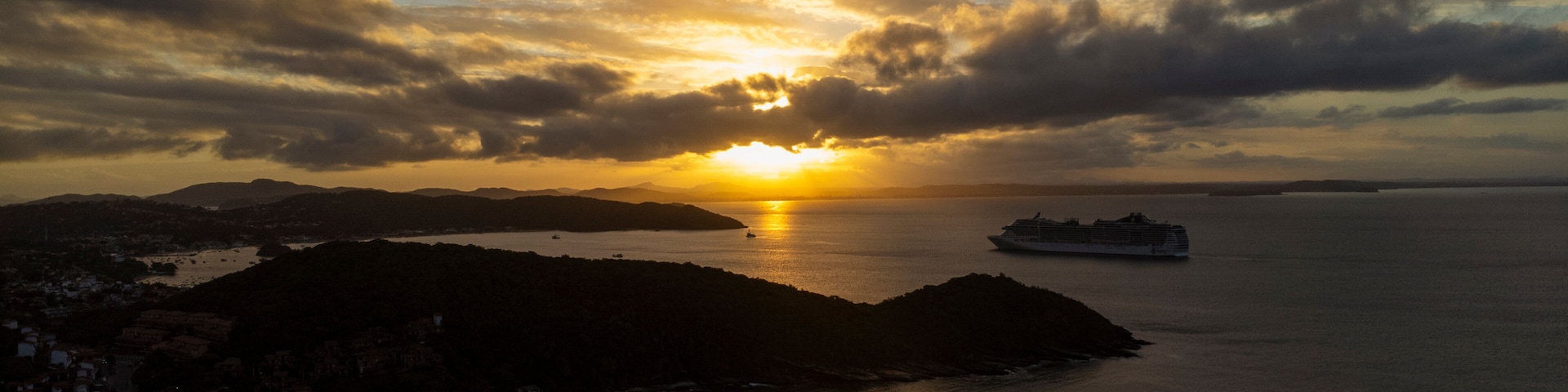 Golden sunset in Búzios with cruise ship seen from João Fernandes beach Rio de Janeiro Brazil – tropical travel destination