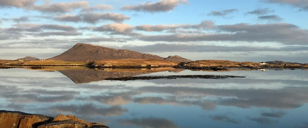 My hometown is near Eaval on the Isle of North Uist in the township of Locheport. Which is on the left of Eaval in this photo. Down a one track road to the very end is a car park with a trail to follow to the base of Eaval. Depending on your level I would say 4 to 6 hours round trip. If you can choose a calm clear day to avoid the wind at the top, and get the best views. From the peak you can the Minch with the Isle of Skye on the other side. The Uist are visible and it is shocking how little land and how much water the islands are made up of.
#hometown
#Mountains
#outerhebrides