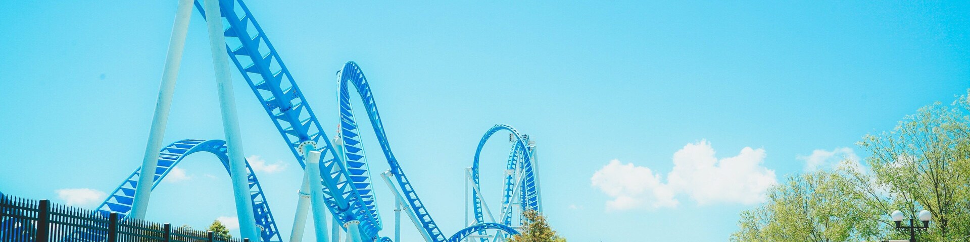 The Park at OWA featuring a fountain and rides