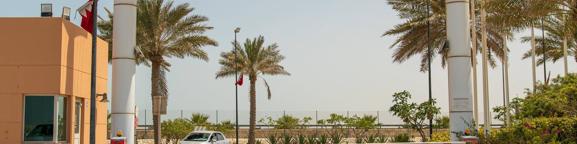 Prince Khalifa Bin Salman Park featuring a coastal town and signage
