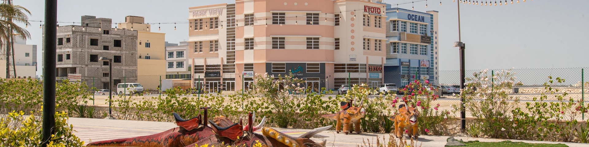 Prince Khalifa Bin Salman Park which includes a coastal town and flowers