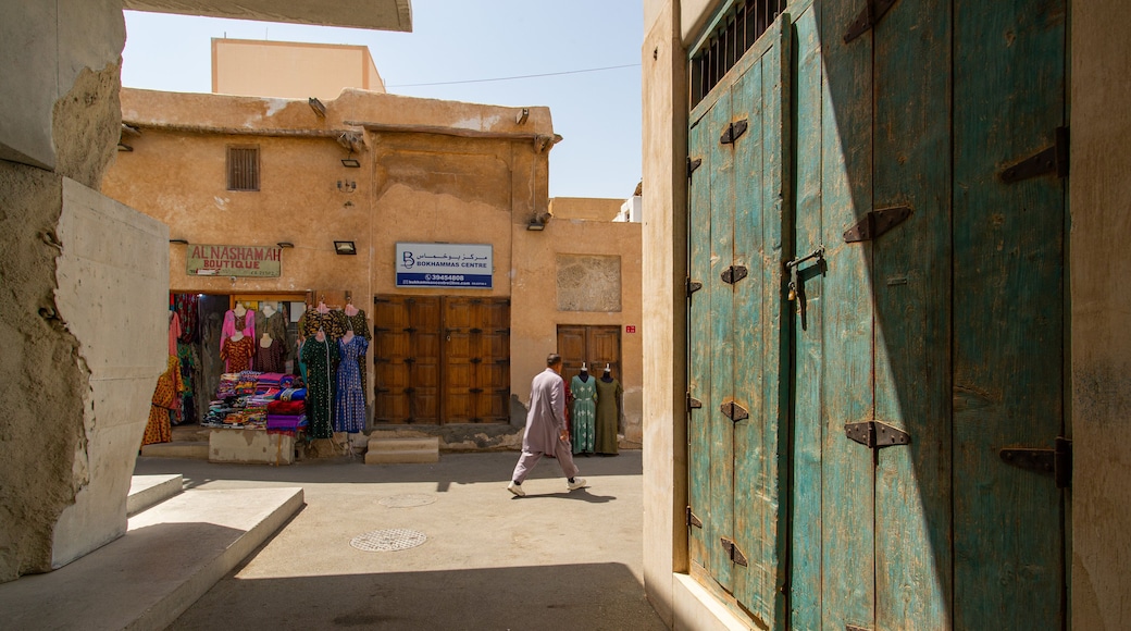 Muharraq Souq featuring street scenes as well as an individual male