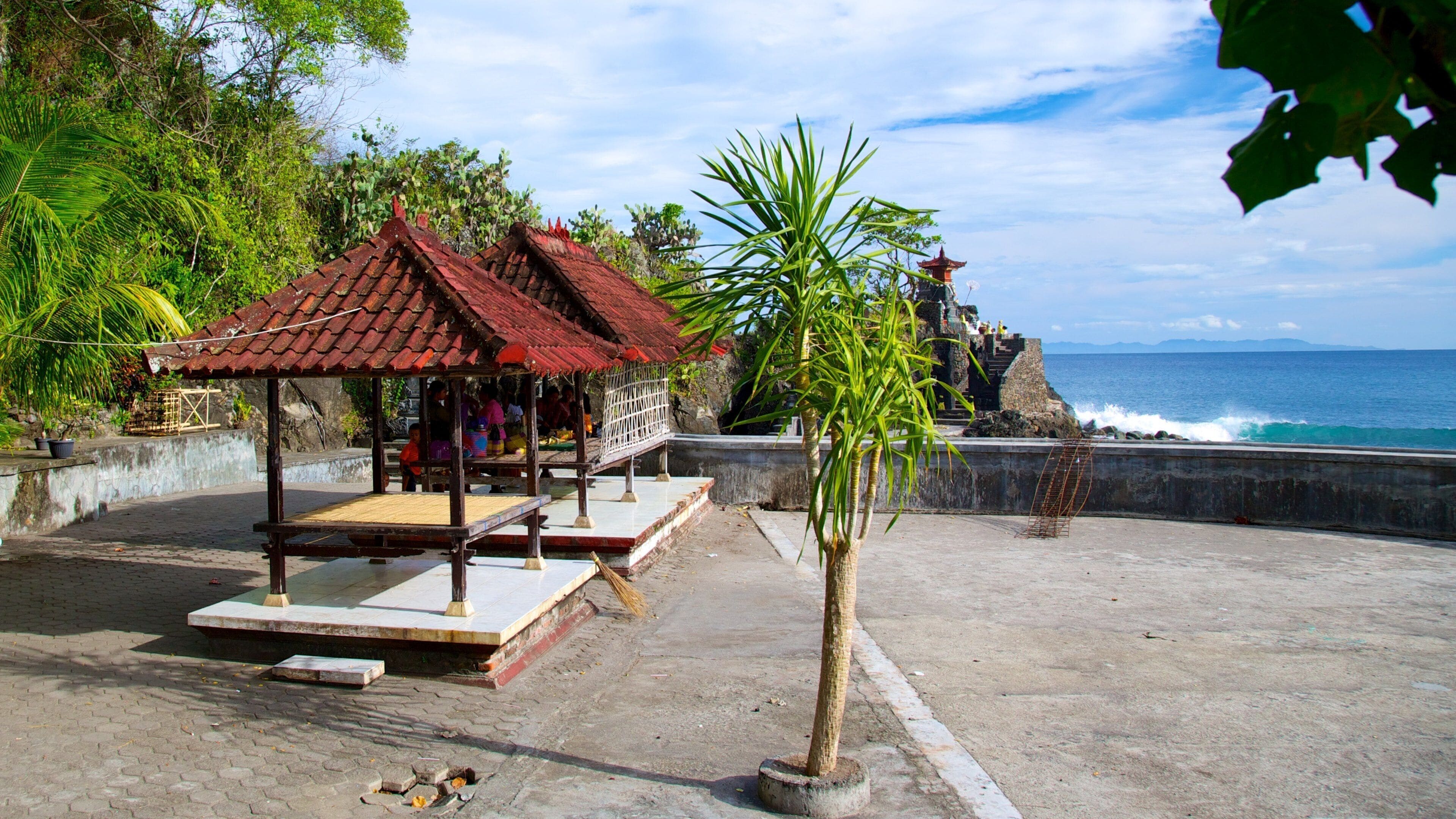 Lombok which includes general coastal views and a temple or place of worship