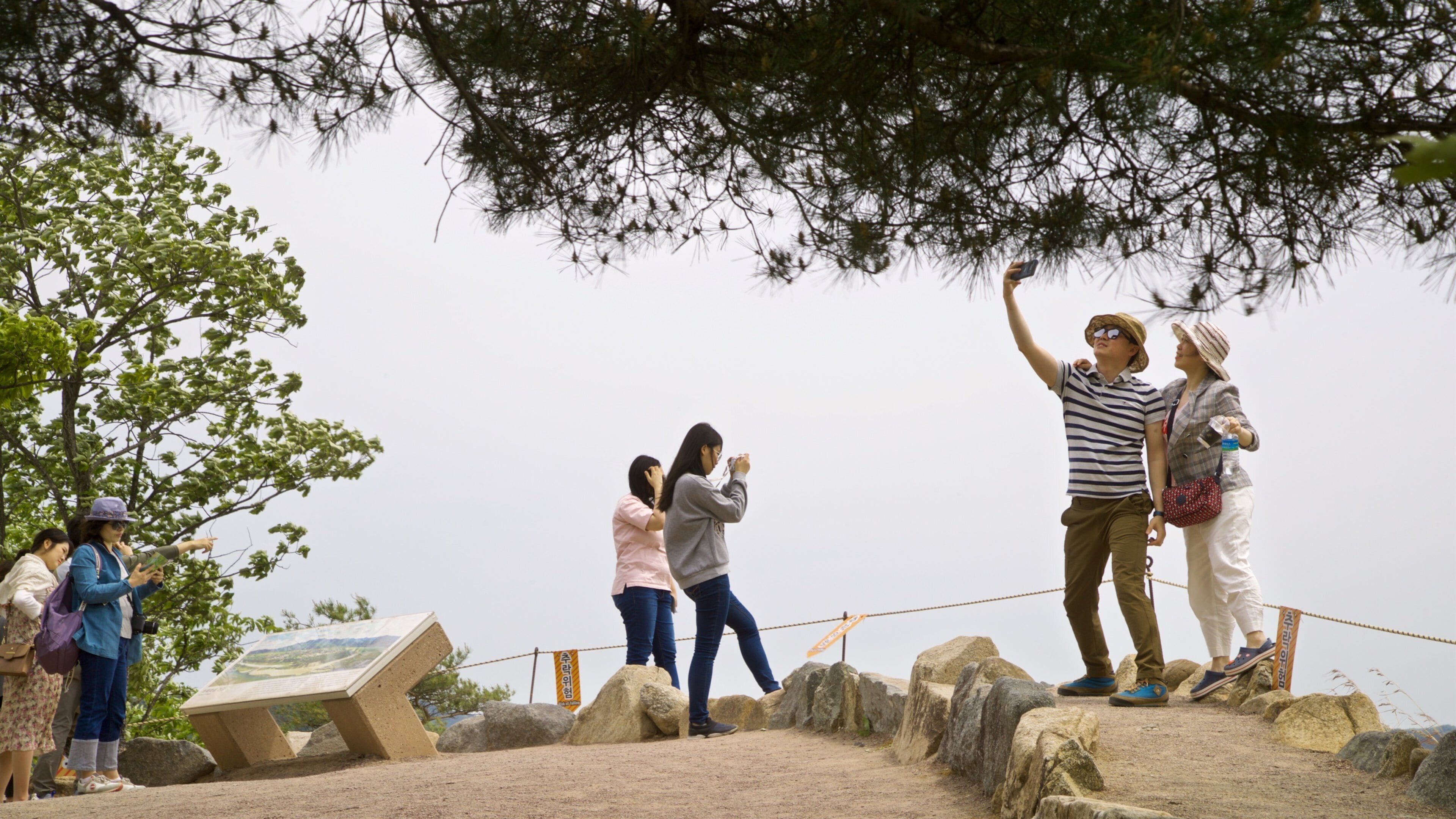 Buyongdae Cliff which includes views as well as a small group of people