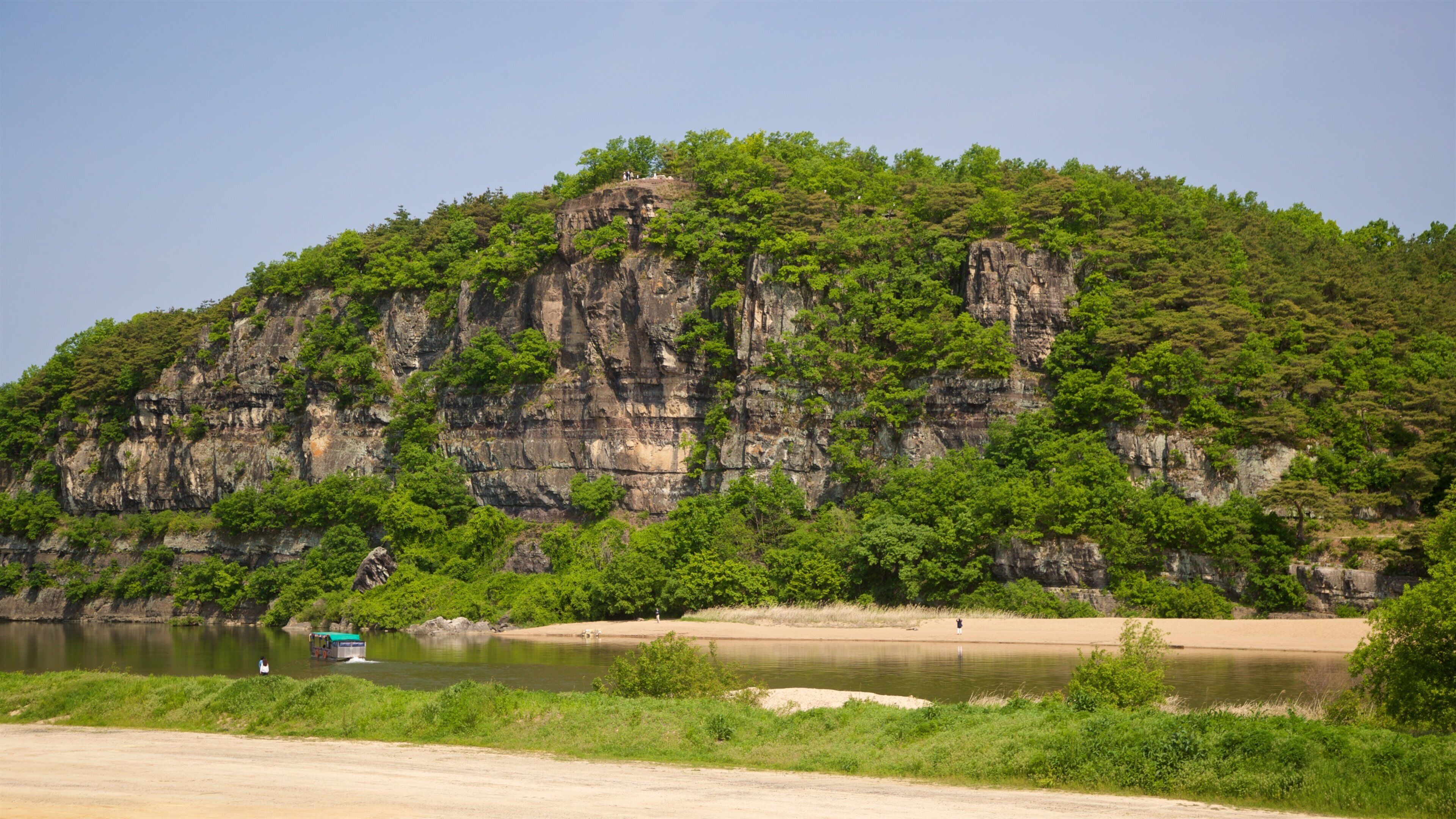 Buyongdae Cliff which includes a river or creek and mountains