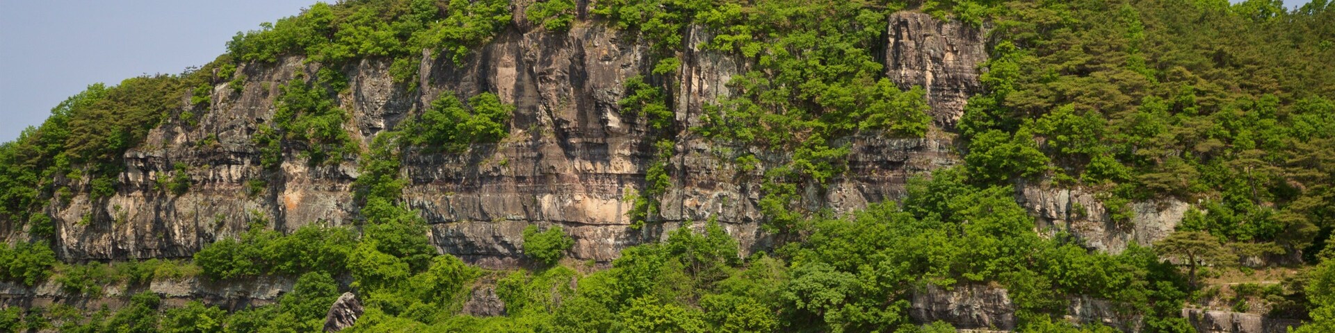Buyongdae Cliff which includes a river or creek and mountains