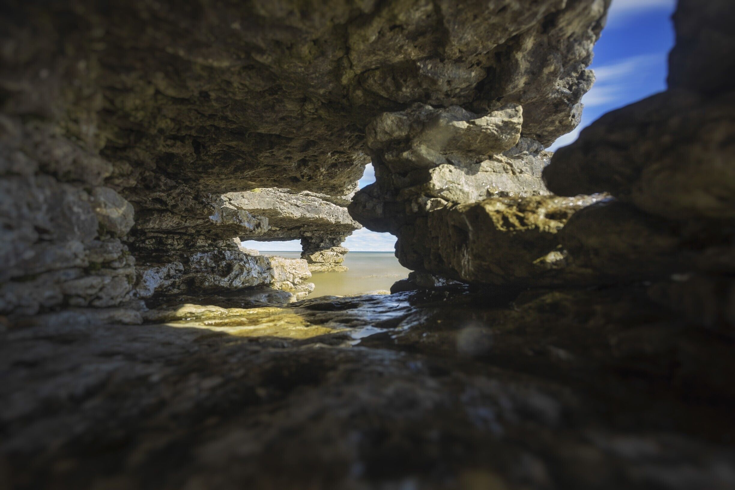 Taken inside one of the caves/arches looking through the ledge to the other one further down. The far arch is the same one from other photos. 
