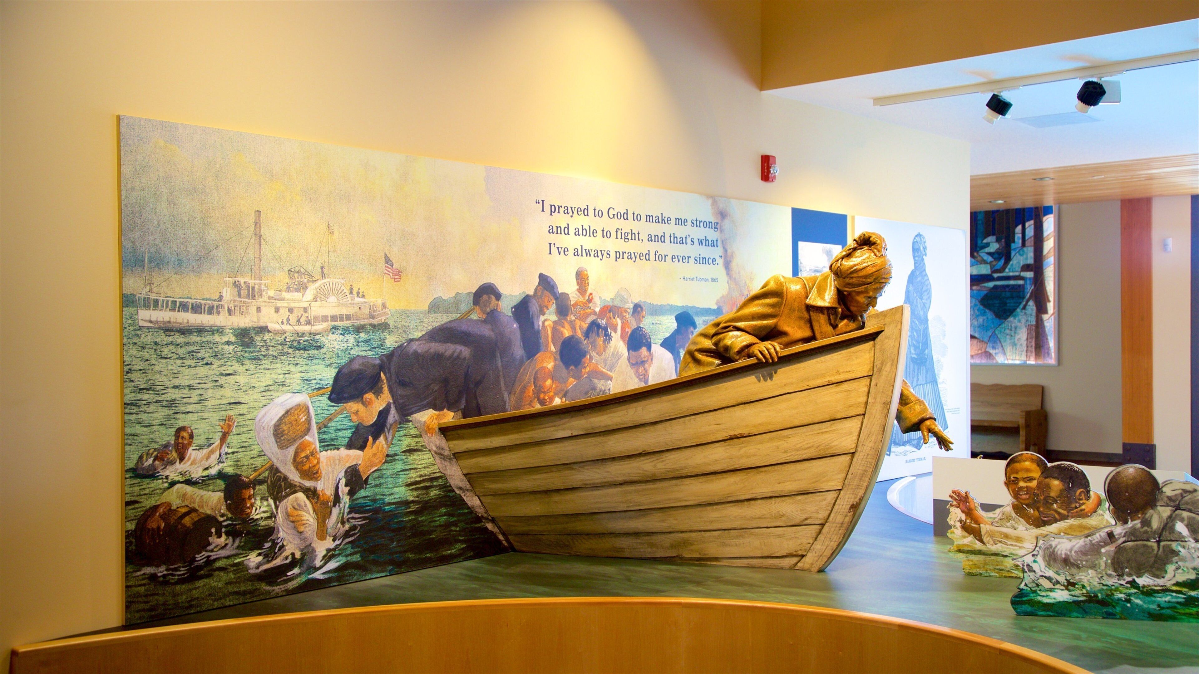 Harriet Tubman Underground Railroad National Historical Park which includes interior views, a statue or sculpture and signage