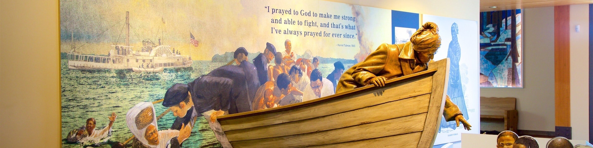 Harriet Tubman Underground Railroad National Historical Park which includes interior views, a statue or sculpture and signage