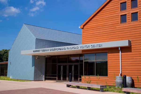 A modern building with a sign reading "Harriet Tubman Underground Railroad Visitor Center".