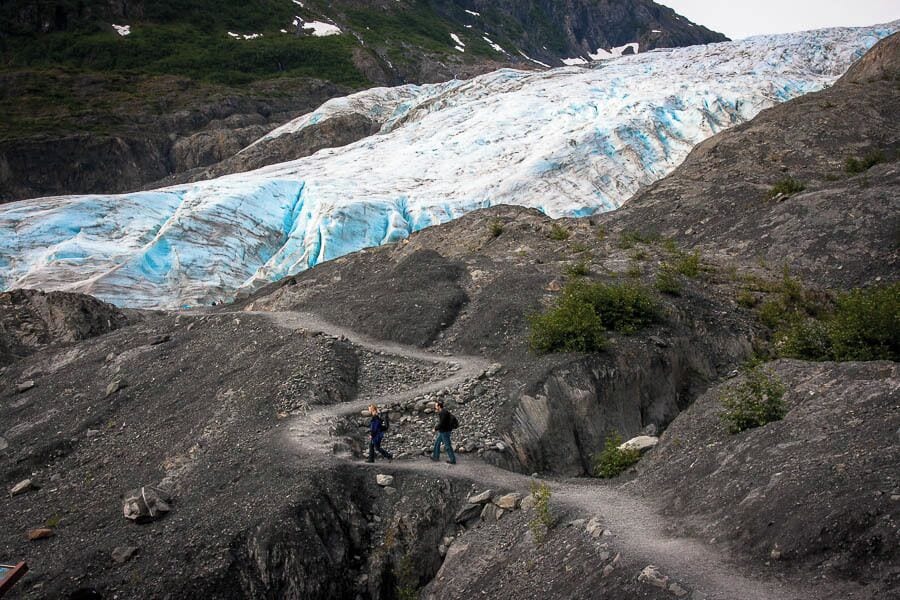 As we hiked closer to Exit Glacier in Alaska's Kenai Fjords National Park I become aware of the enormity of this sheet of ice that has carved out the valley and the river behind us. Signposts marking how far the glacier has receded point to how fragile the glacial ecosystem is.You can't help but be awed by what a glacier and a few thousand years can do to a landscape.  #NationalPark    http://casualtravelist.com/blog/kenai-fjords-national-park/