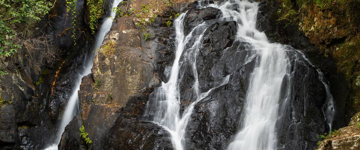 Mount Hypipamee National Park showing a waterfall and a river or creek