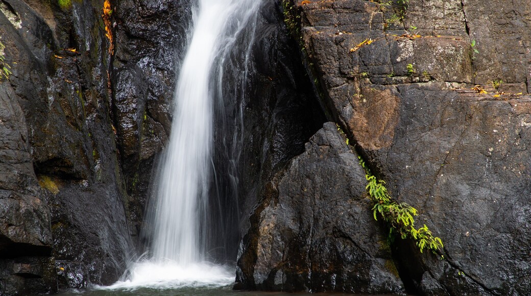 Mount Hypipamee National Park featuring a cascade and a lake or waterhole