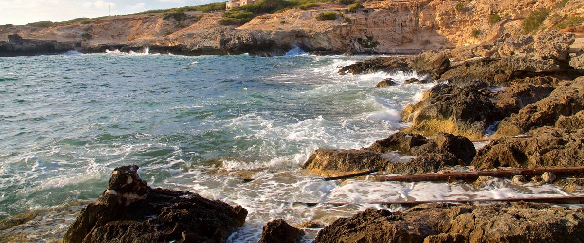 Caló des Mort showing general coastal views and rocky coastline
