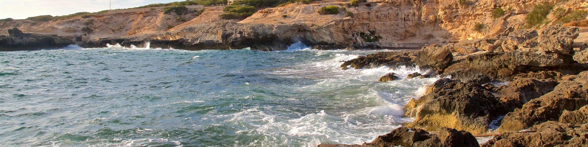 Caló des Mort showing general coastal views and rocky coastline