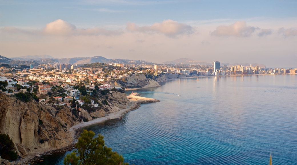 Cala de Gasparet featuring a sunset, a coastal town and landscape views