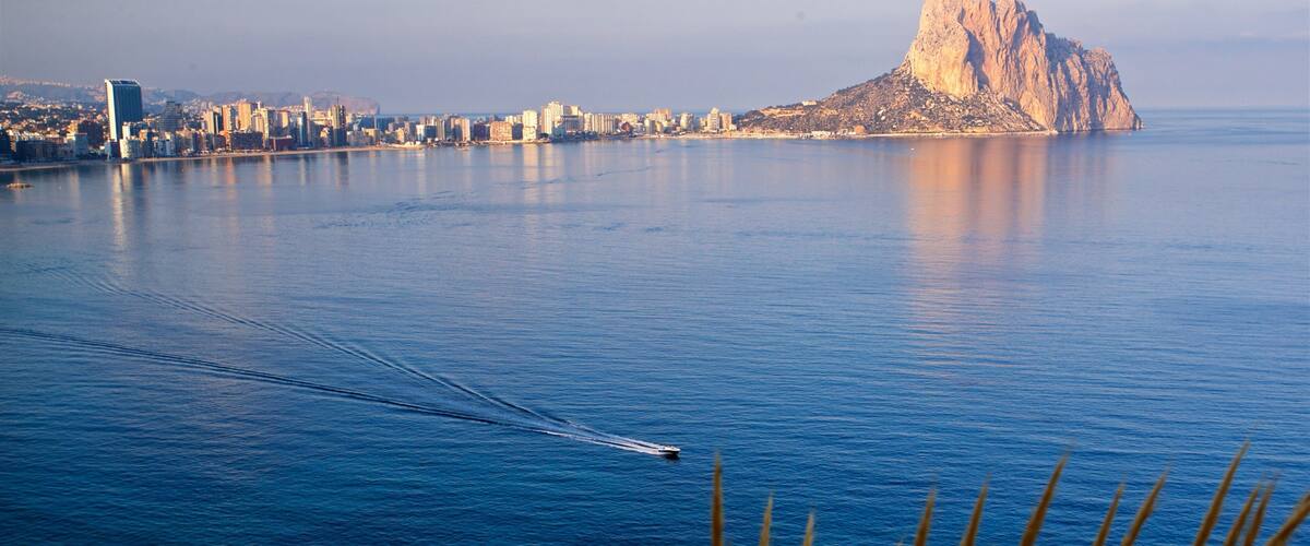 Cala de Gasparet showing boating, a sunset and landscape views