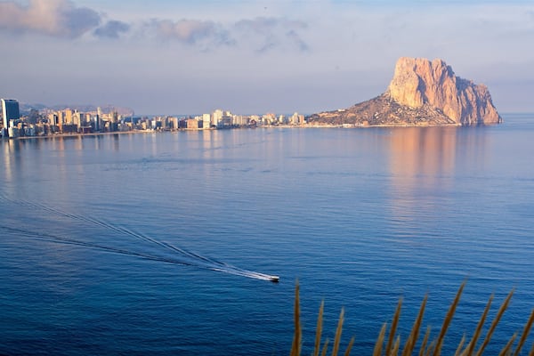 Cala de Gasparet showing boating, a sunset and landscape views