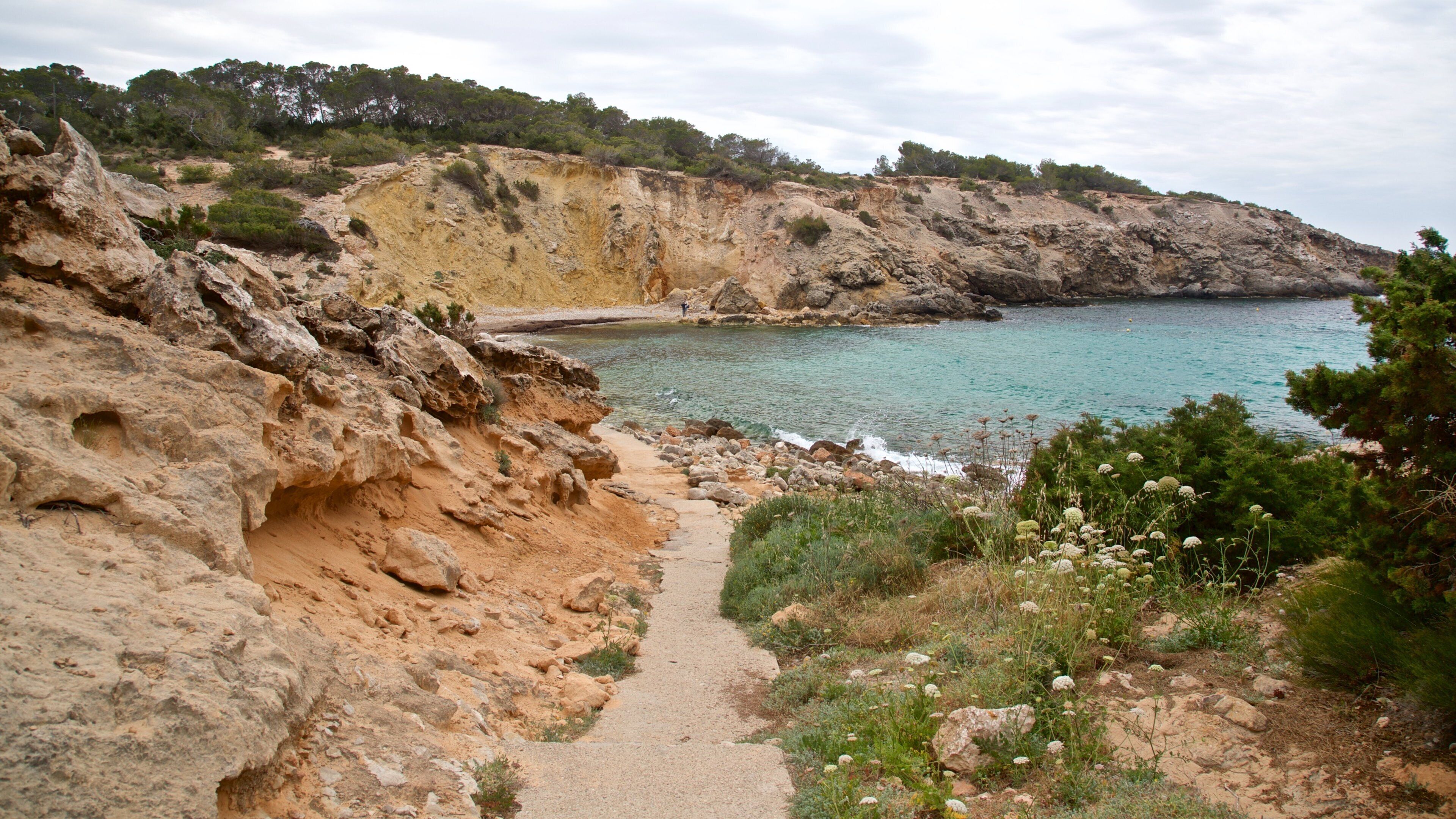 Cala Codolar which includes general coastal views and rugged coastline