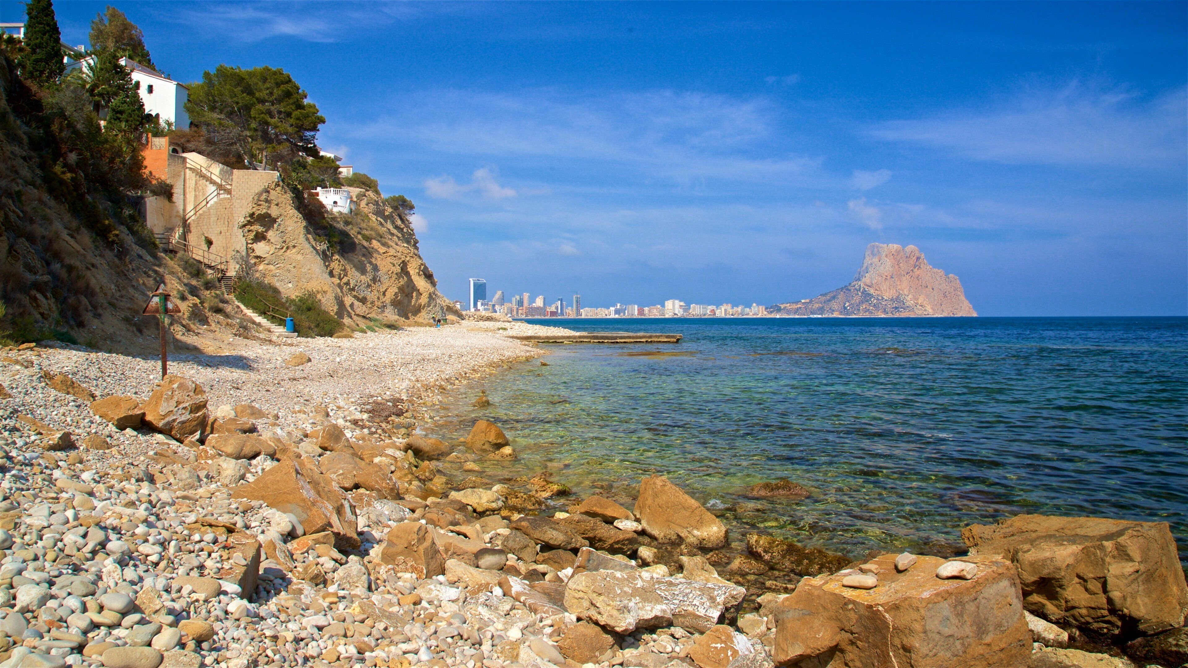 Cala Les Urques featuring a pebble beach and general coastal views