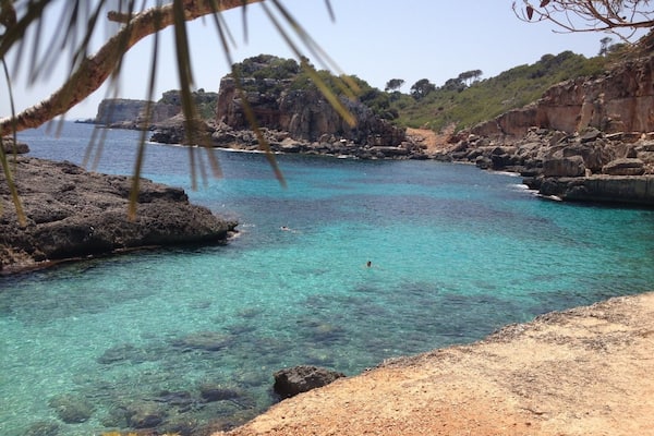 the water is cristal clear, perfect for snorkeling - there is a very small sandy beach, or you can jump from the cliffs into the water