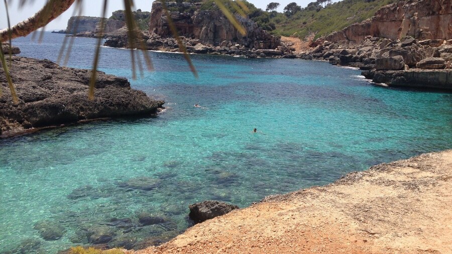 the water is cristal clear, perfect for snorkeling - there is a very small sandy beach, or you can jump from the cliffs into the water