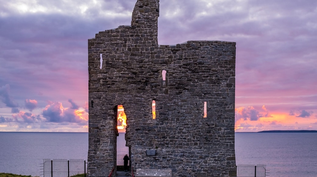 Sunset behind old castle ruins. Ballybunion, Co. Kerry, Ireland.