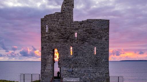 Sunset behind old castle ruins. Ballybunion, Co. Kerry, Ireland.