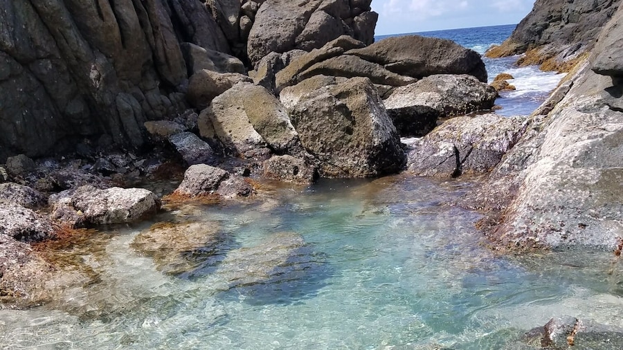 Great spot on Jost Van Dyke. When there is a north swell, the waves crash inyo the rocks and throw foam into the pool