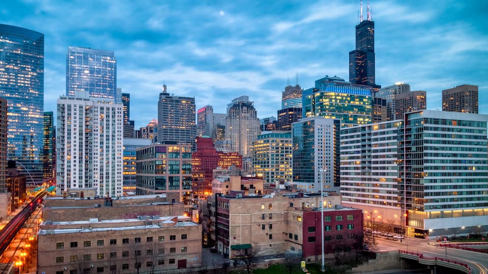 Blue Hour evening cityscape in West Loop neighborhood. Long exposure, nightscape architecture. Main street in Chicago, streets in Illinois.